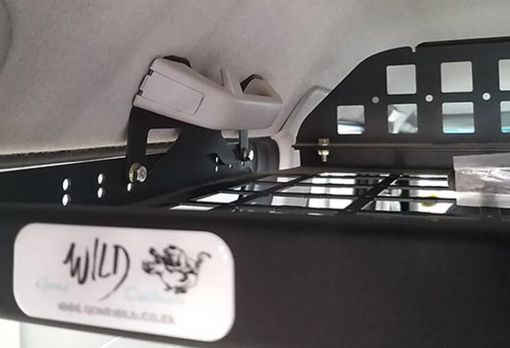 A Gone Wild interior equipment rack fitted against the roof lining of an SUV